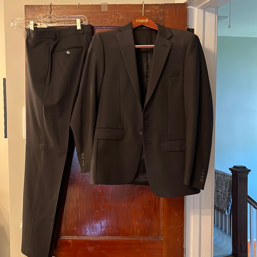 Mens dress suit. Charcoal grey.  Worn one time.  Jacket 38 regular. Pants 30x32